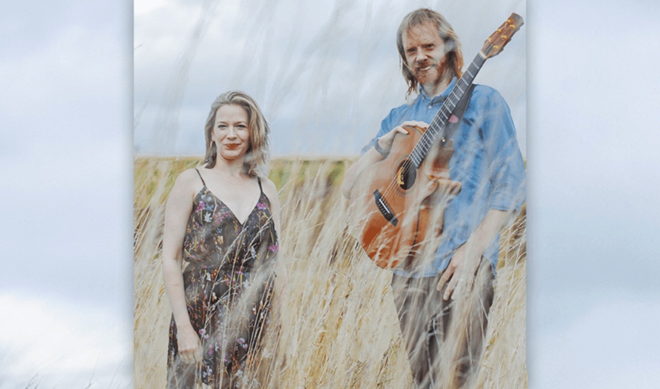 Kirsty Merryn and Ben Walker in a field